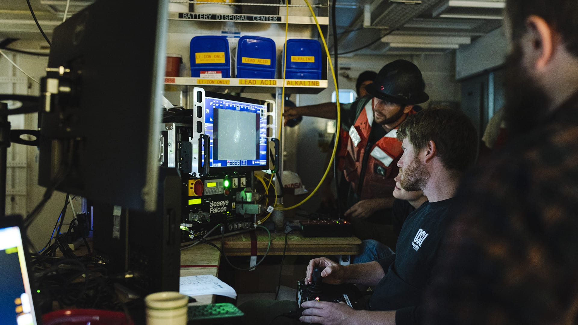 WHOI Engineer Jared Schwartz pilots the remotely operated vehicle, Saab Seaeye Falcon to investigate an unrecovered mooring anchor. (Photo by Daniel Hentz, Woods Hole Oceanographic Institution)